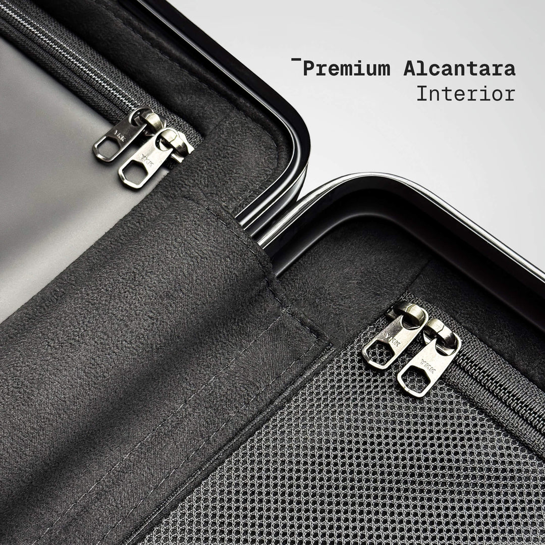 Close-up of a suitcase with premium Alcantara interior and zippers.