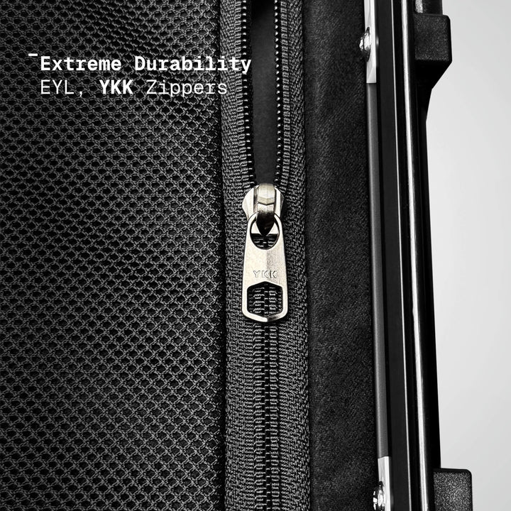 Close-up of a black suitcase with a YKK zipper, emphasizing durability.
