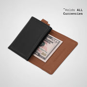 Two-tone wallet with a dollar bill inside on a light gray background