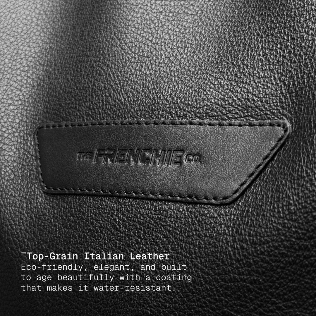 Embossed logo detail on black leather