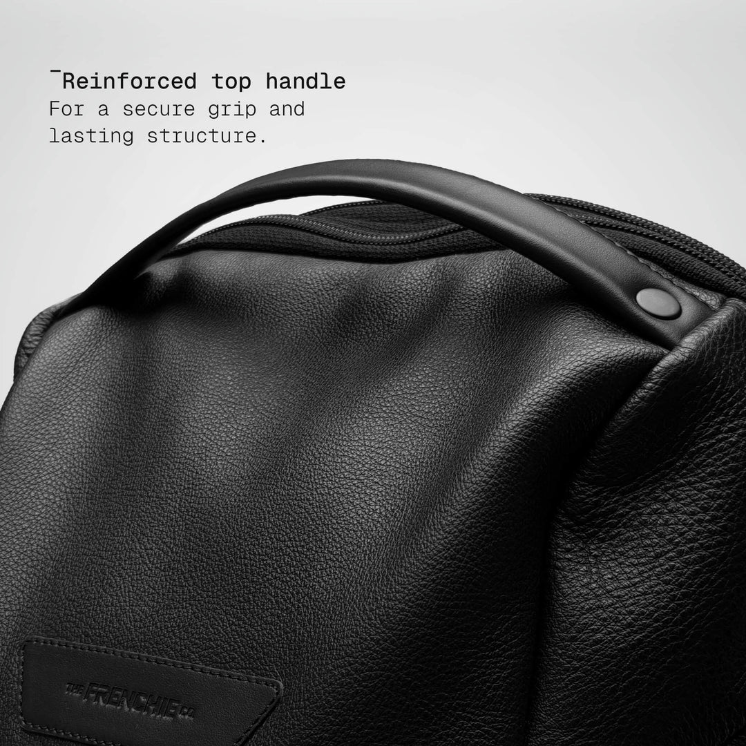Top handle detail on the black leather Vector Speed Backpack
