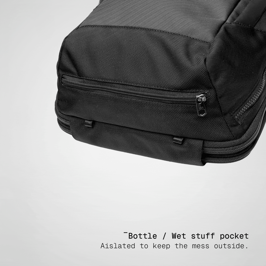 Water bottle going into the side pocket of the Vector Speed Backpack