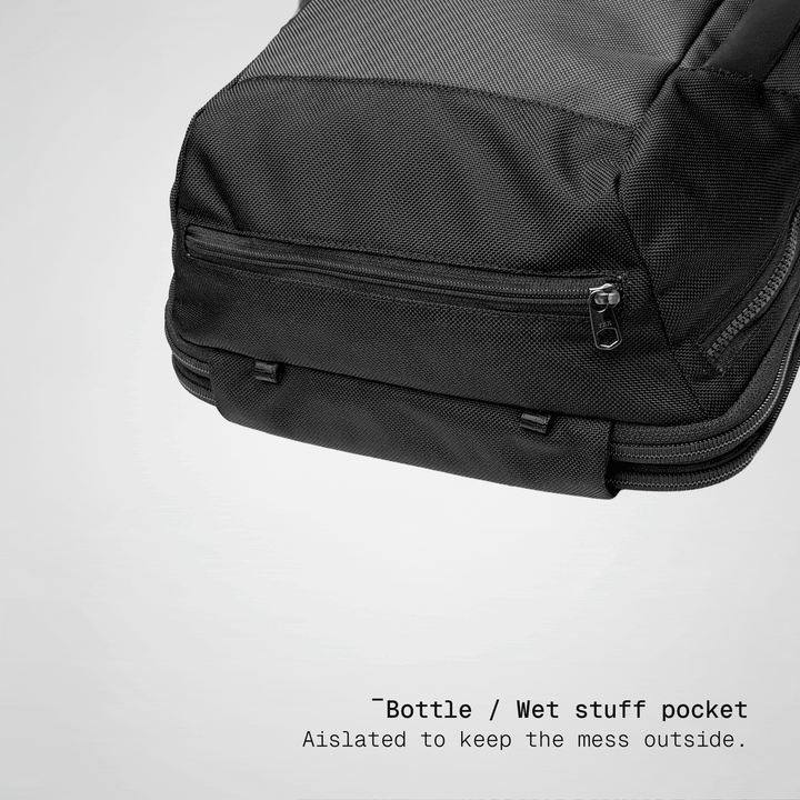 Water bottle going into the side pocket of the Vector Speed Backpack