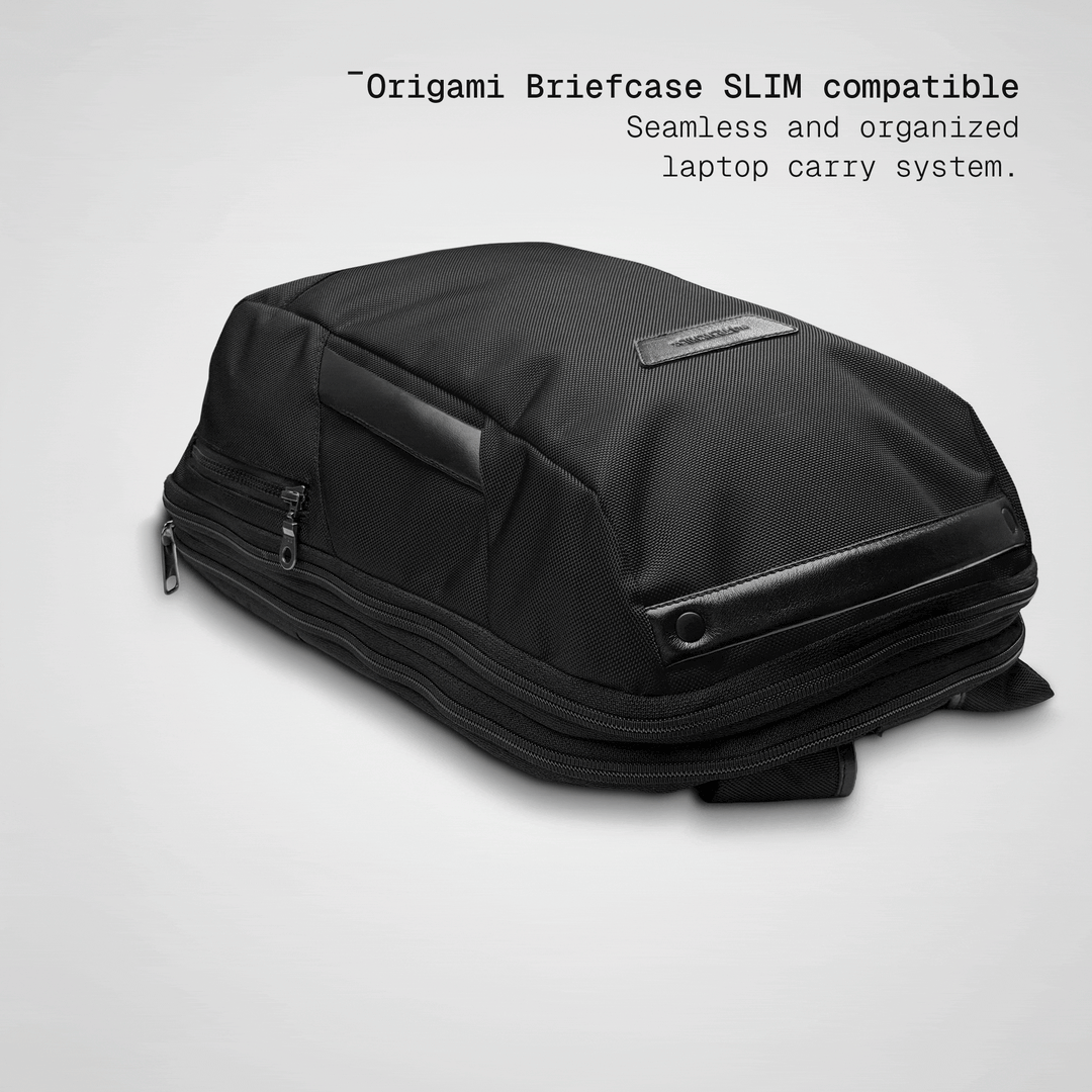 Slim briefcase sliding into the black Vector Speed Backpack