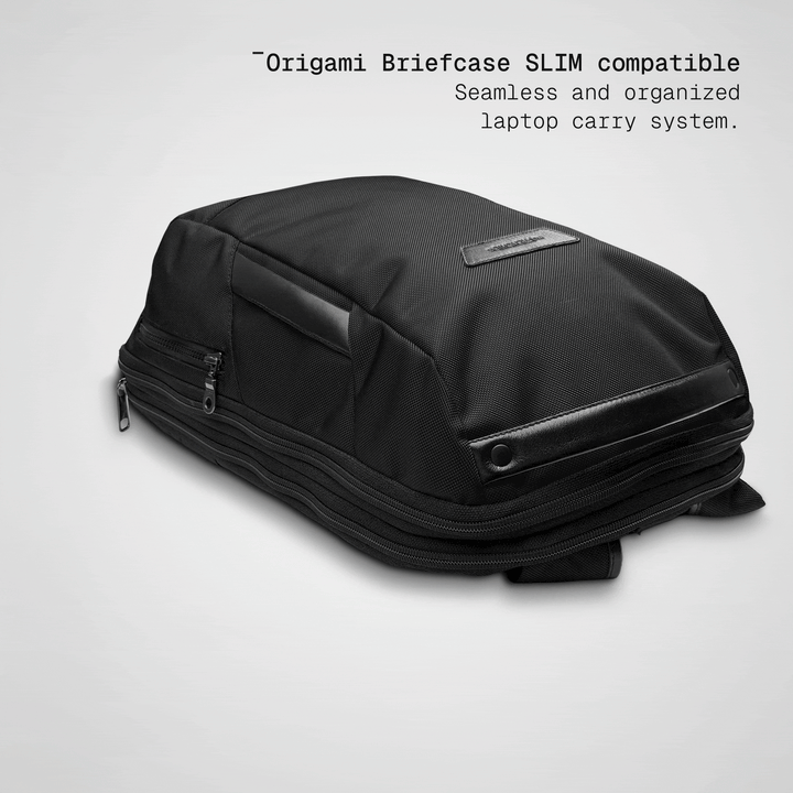 Slim briefcase sliding into the black Vector Speed Backpack