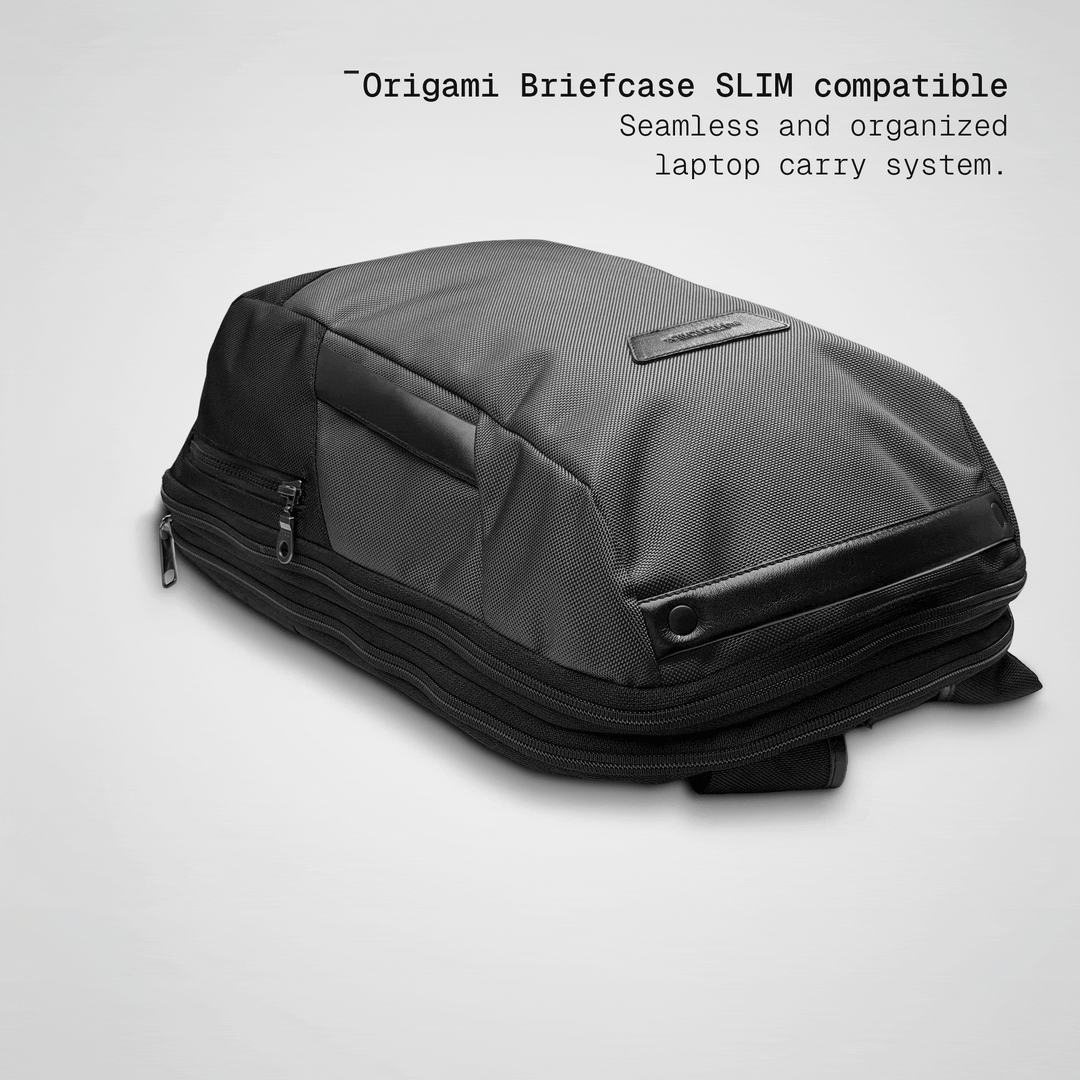 Slim briefcase sliding into the grey Vector Speed Backpack