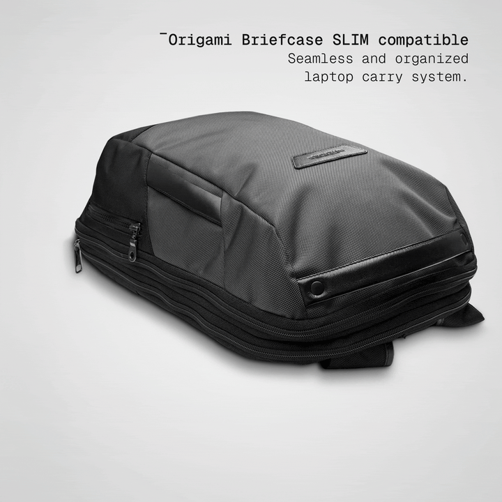 Slim briefcase sliding into the grey Vector Speed Backpack