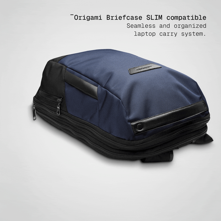 Slim briefcase sliding into the ultra navy Vector Speed Backpack