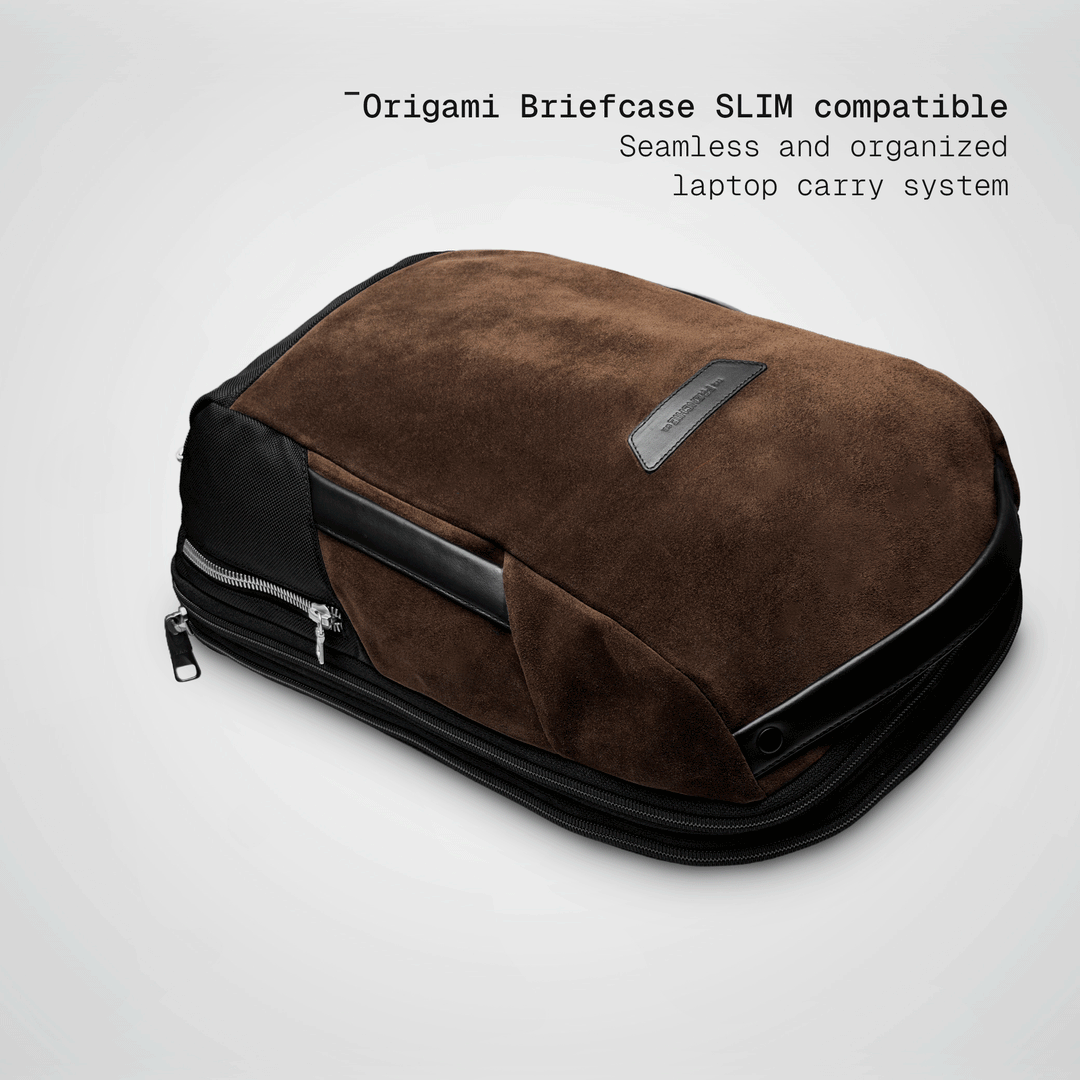 Slim briefcase sliding into the brown Vector Speed Backpack