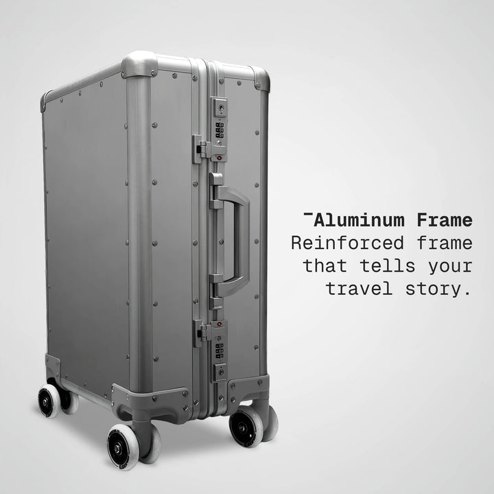 Silver suitcase with text about an aluminum frame on a light gray background