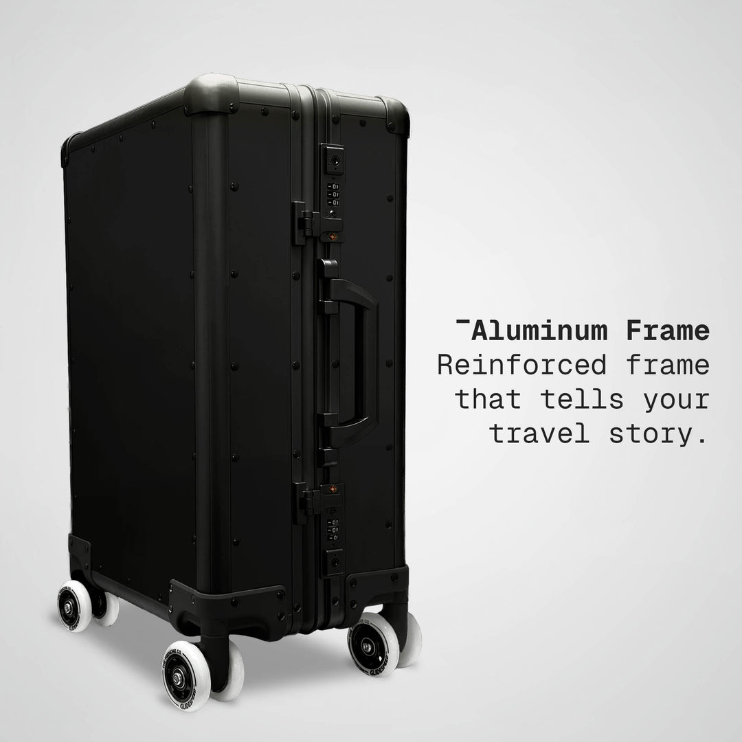 Black suitcase with text about an aluminum frame on a light gray background
