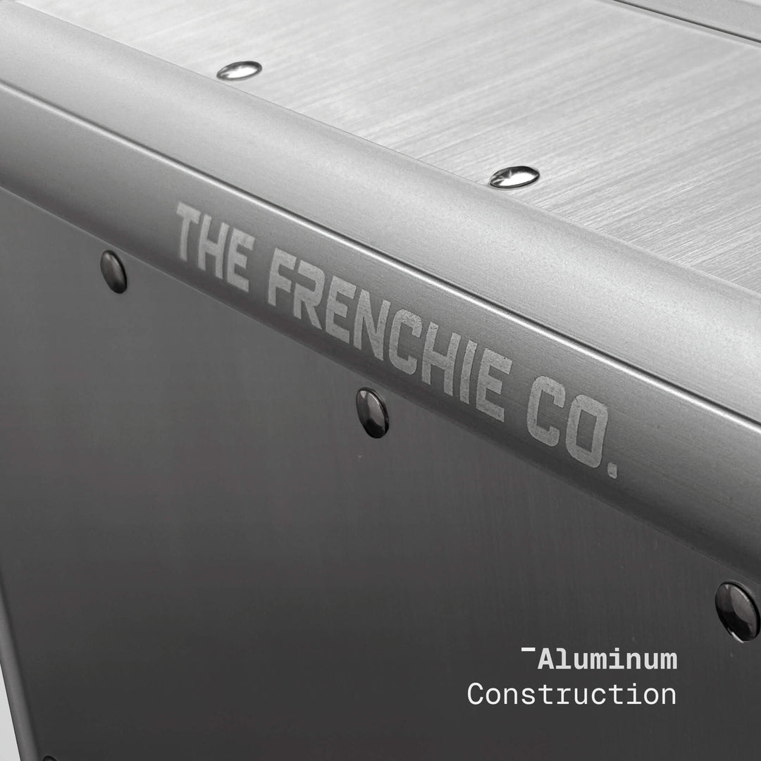 Metallic surface with 'The Frenchie Co.' branding and 'Aluminum Construction' text.