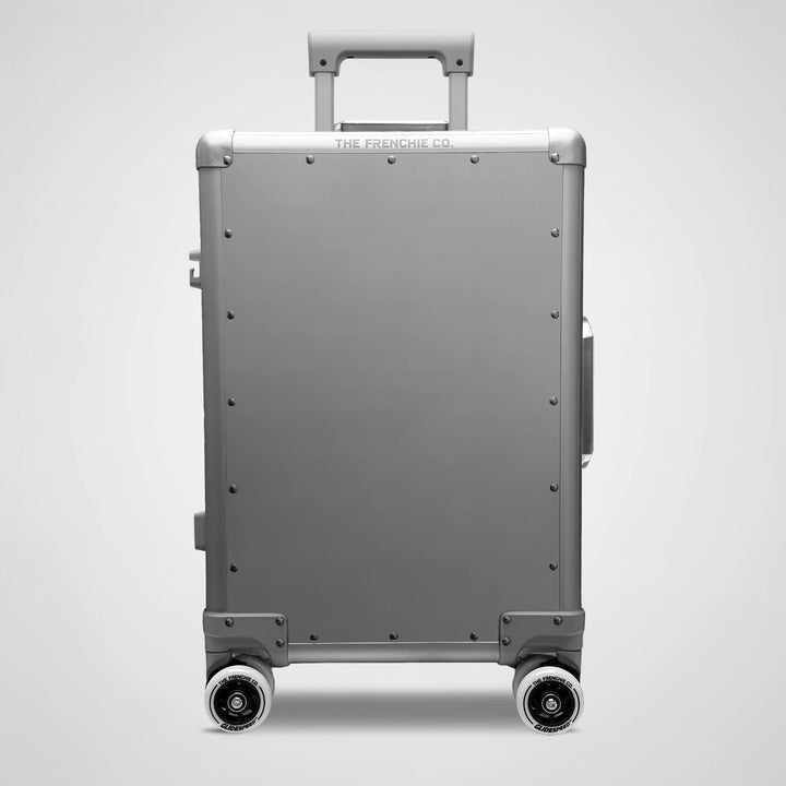 Gray suitcase with wheels on a light gray background