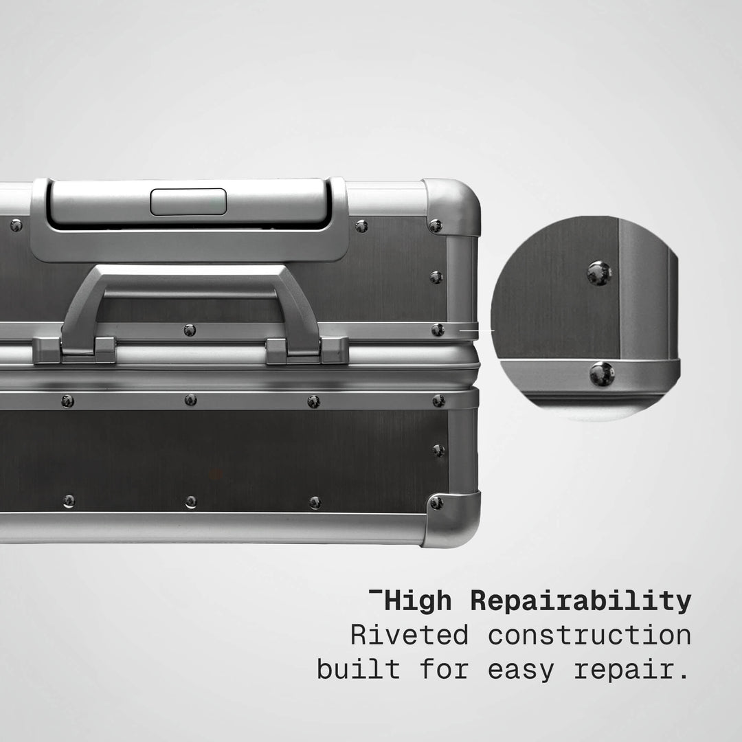 Silver metal case with riveted construction feature on a gray background