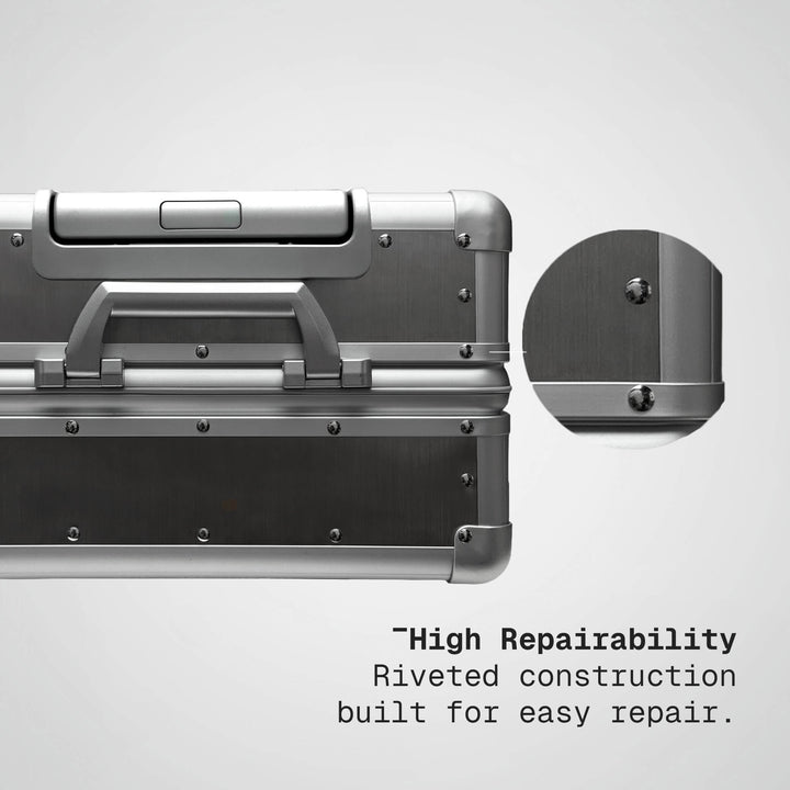 Silver metal case with riveted construction feature on a gray background