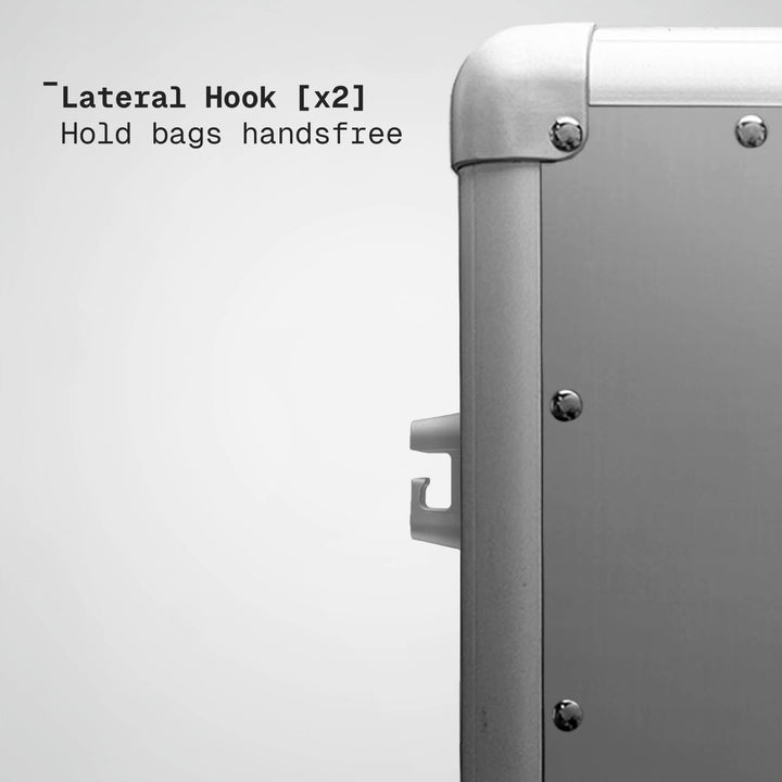Metallic suitcase with lateral hooks on a white background