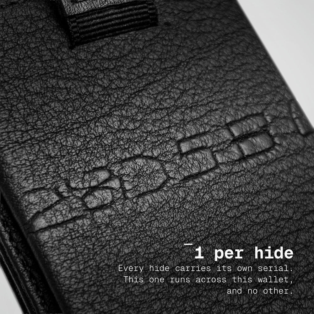 The hide's own serial pressed across the front of the Numbered Togo Speed Wallet Duo, 1 per hide
