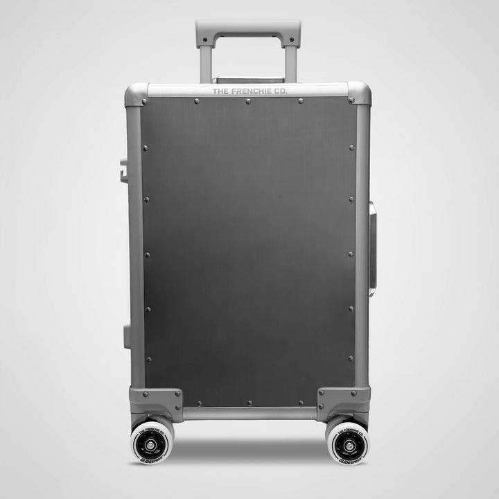 titanium suitcase with wheels on a light gray background