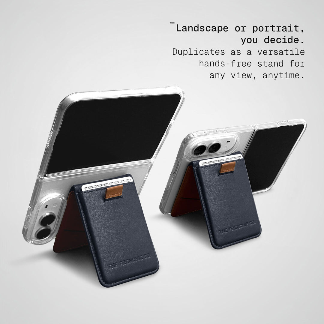 Two iPhone Duos in clear cases standing on Ultra Navy-Tan Speed Wallet Duos, one in landscape and one in portrait
